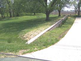This berm protects the home from flooding from the stream to the left.